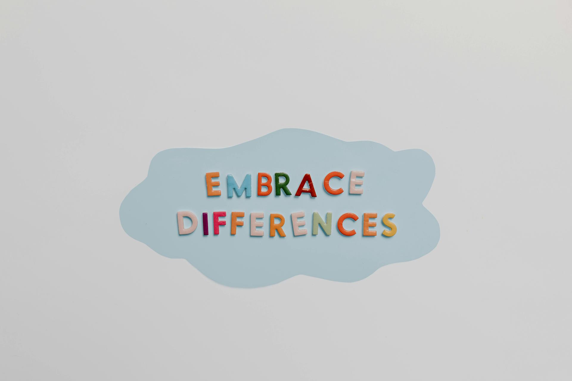 Mental health awareness sign that says to embrace differences as a result of mental health therapy and counseling in Wake Forest, NC