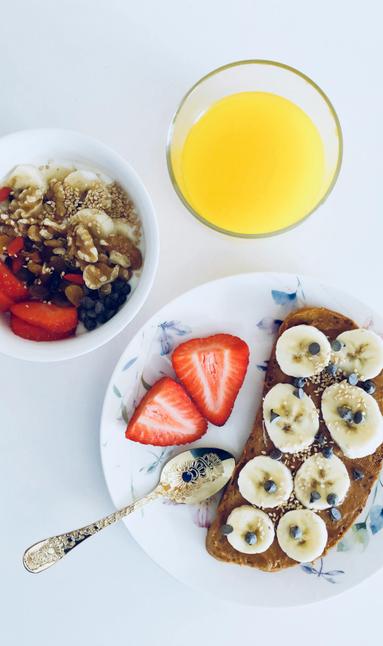 A nutritious meal of fruit, juice, and grains on a plate signifying diet and nutrition changes as part of health coaching near Wake Forest